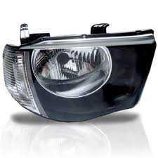 Farol Mitsubishi L200 06/12 H4 C/Pisca Cristal